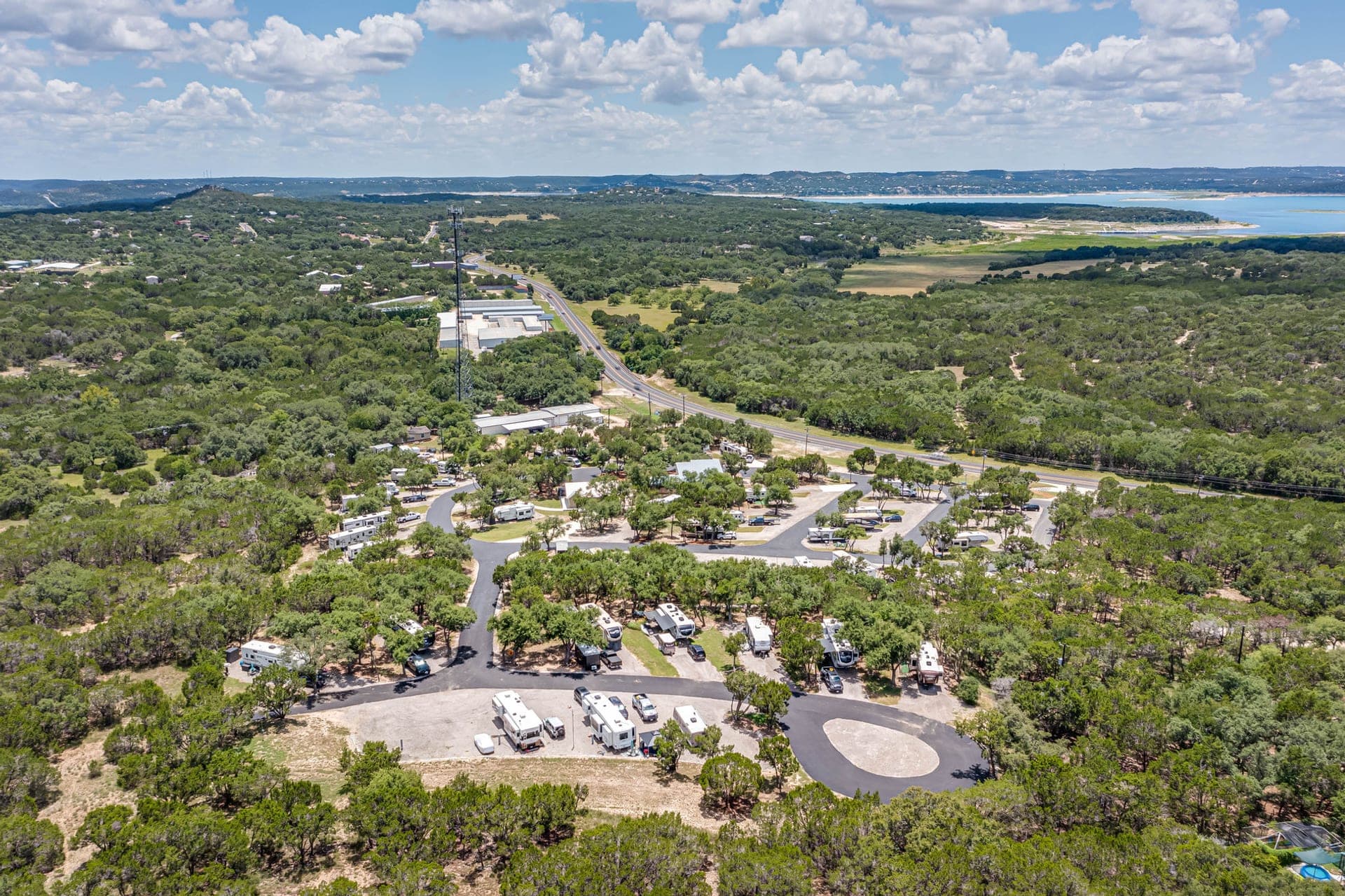 Aerial view of the park among oaks, the lake in the distance