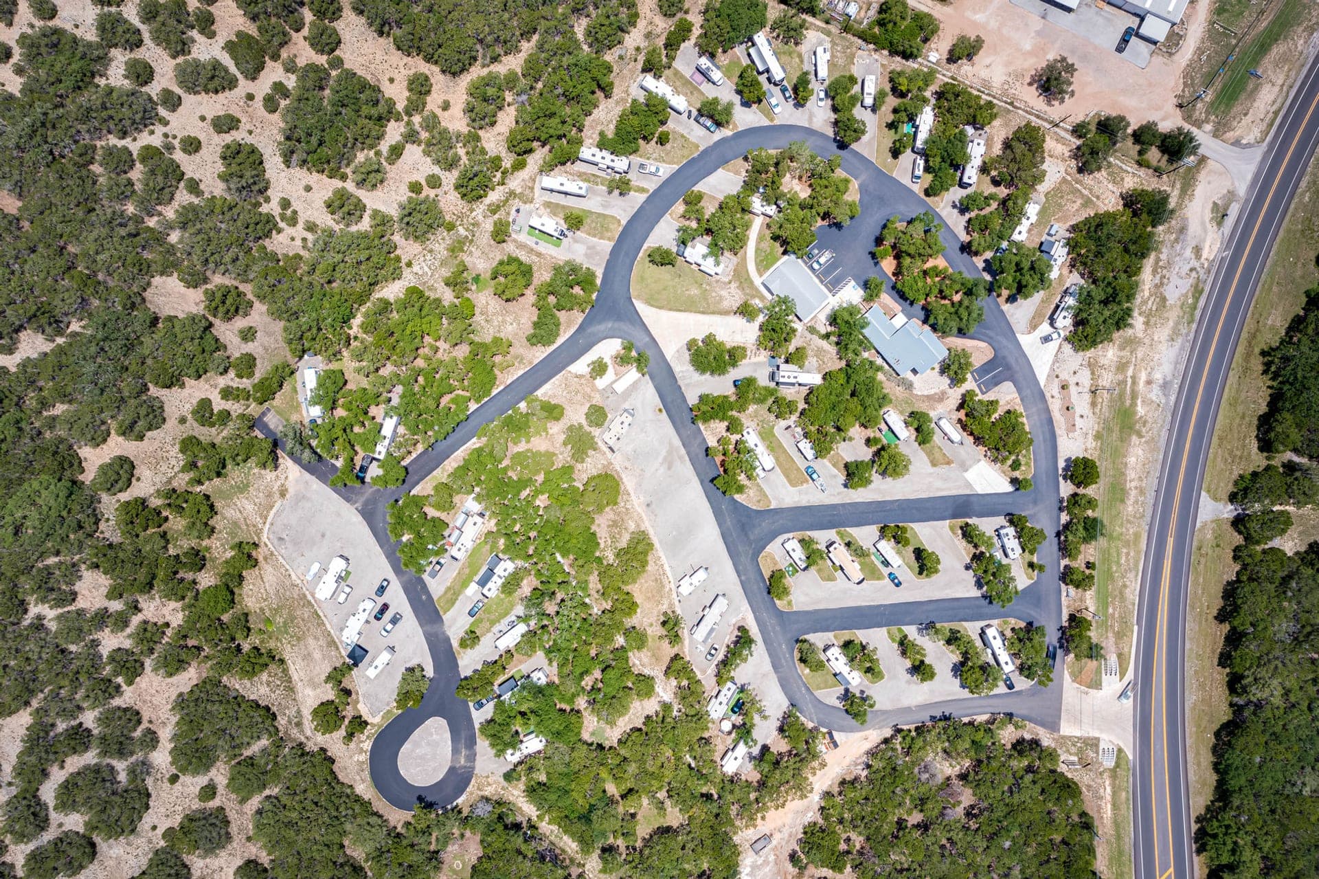 Top-down aerial of the park's loop drives and pads